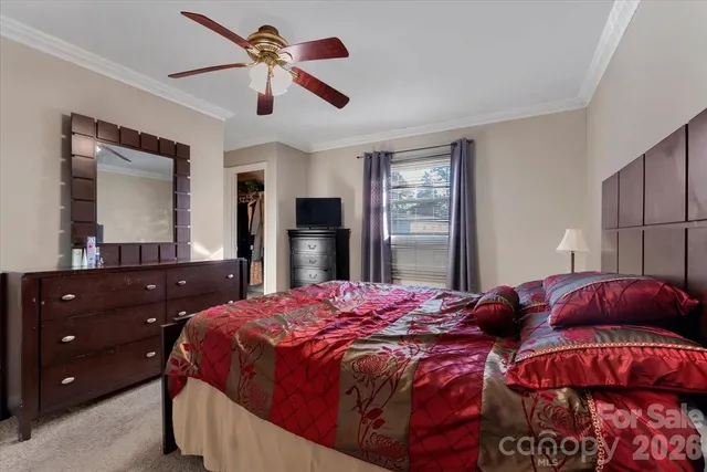 a bedroom with a bed and a closet with mirror