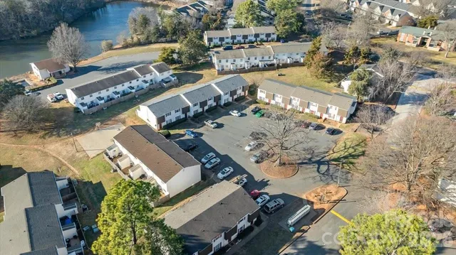 an aerial view of a house with a lake view