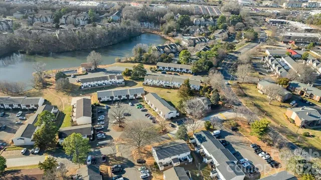 an aerial view of a city with lake view