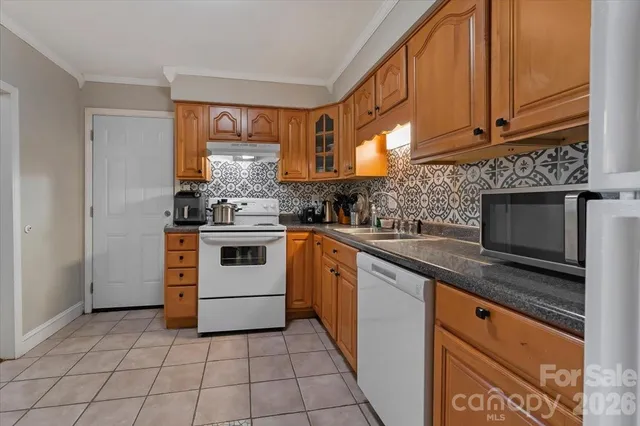 a kitchen with a stove and a microwave
