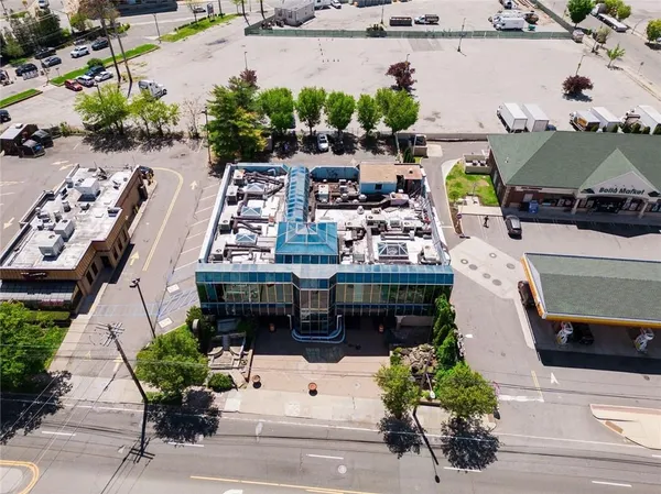 an aerial view of a building with outdoor space