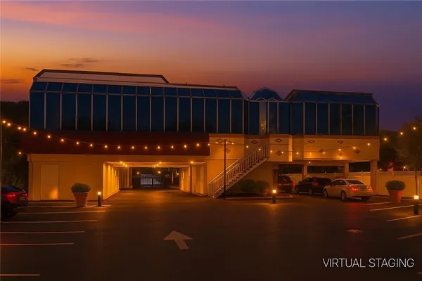 a view of a street with parked cars
