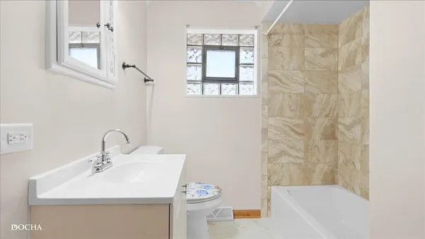 a bathroom with a sink a mirror and a shower