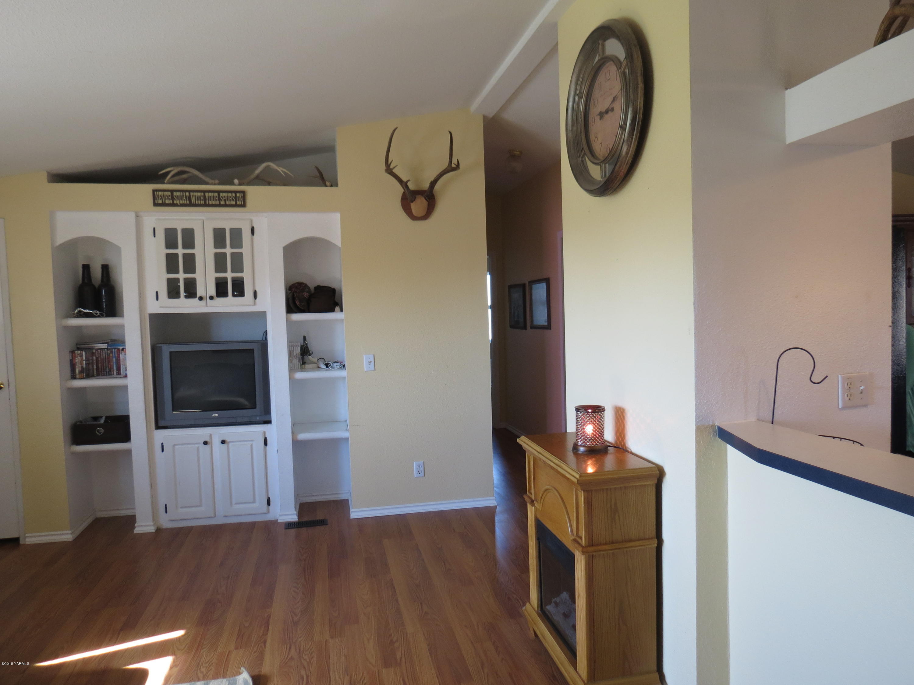 515 Burnham Road Yakima, WA 98908 - Photo 12 of 20 a view of a storage & utility room with racks on the wall