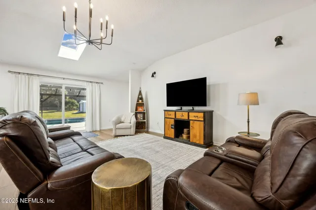 a kitchen with stainless steel appliances a stove a microwave and cabinets
