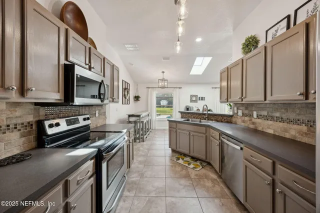 a living room with furniture and a bookshelf