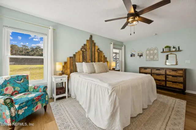 a bedroom with a bed and a couch