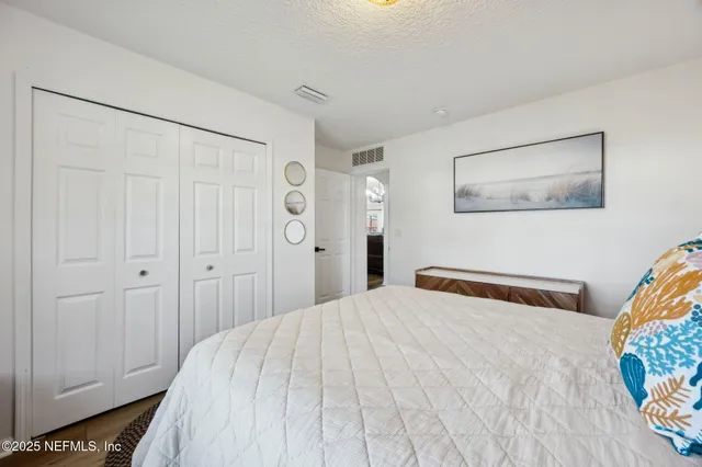 a view of a workspace with furniture and wooden floor