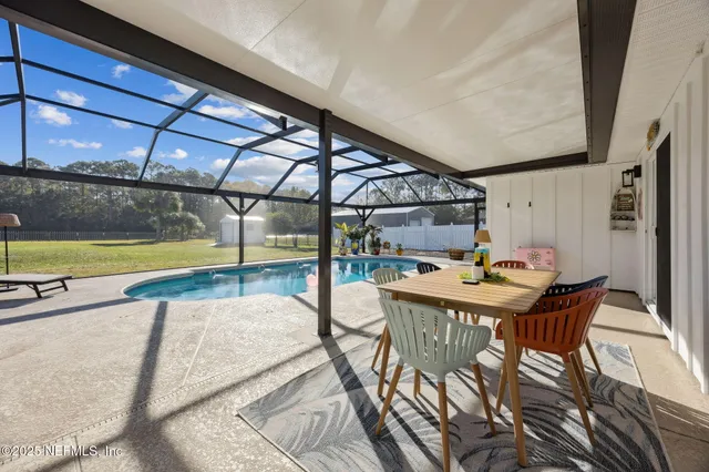 a view of a swimming pool with a patio