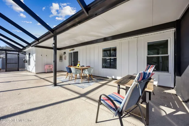 a front view of house with yard and outdoor seating