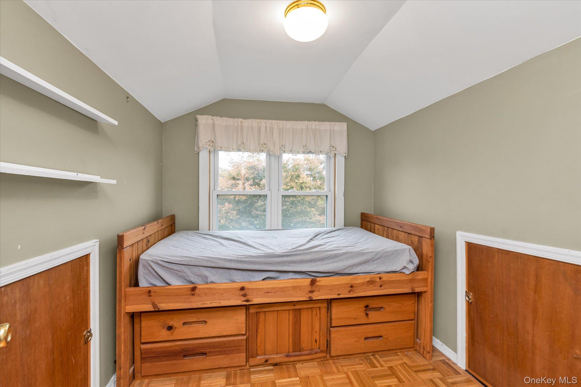 1894 Commonwealth Avenue Merrick, NY 11566 - Photo 18 of 22 a bedroom with a bed and a window