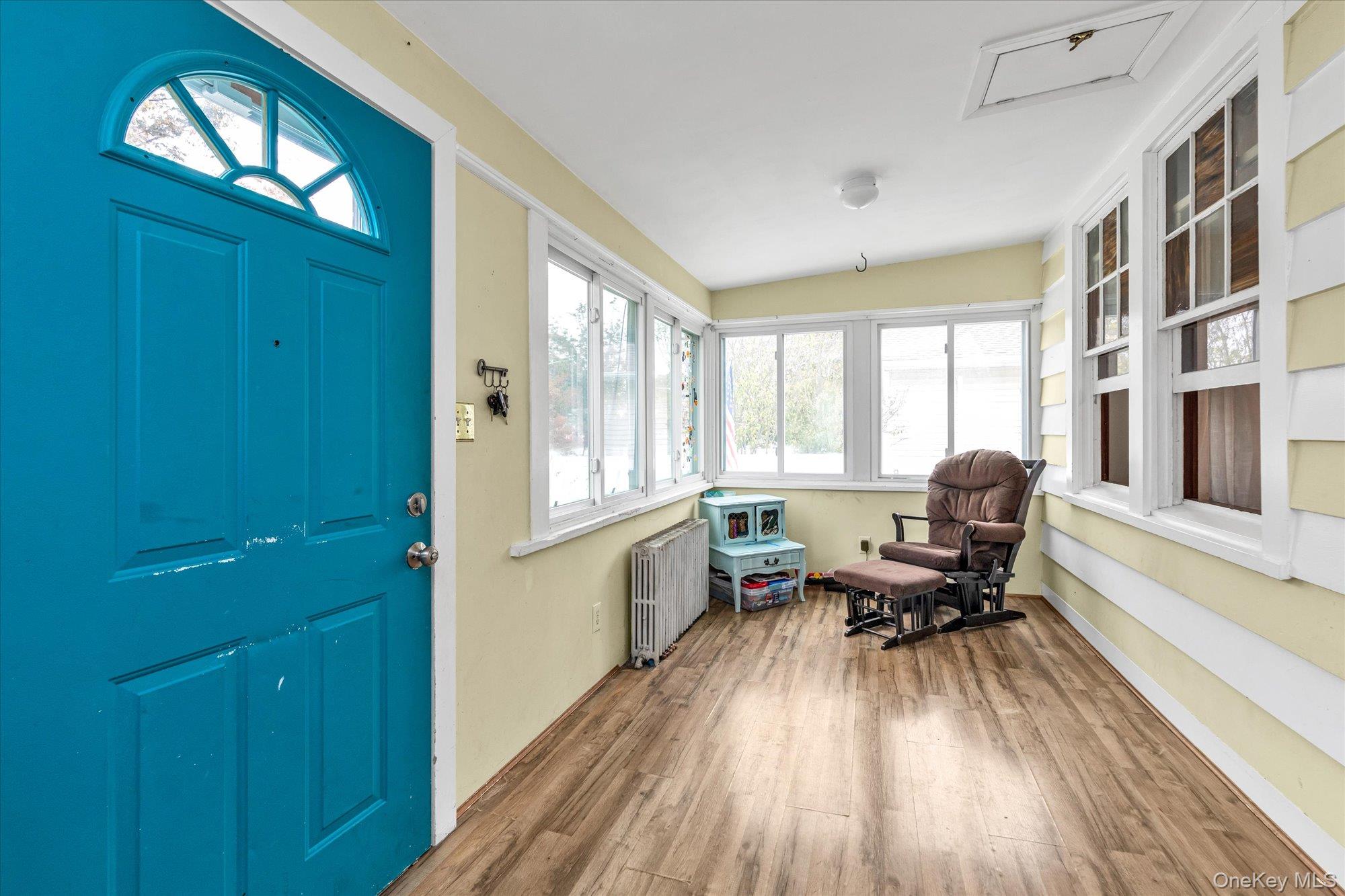 1894 Commonwealth Avenue Merrick, NY 11566 - Photo 4 of 22 a living room with furniture and a wooden floor