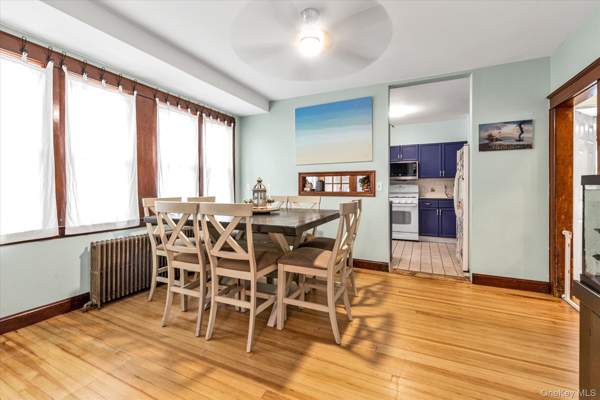 1894 Commonwealth Avenue Merrick, NY 11566 - Photo 9 of 22 a view of a dining room with furniture and wooden floor