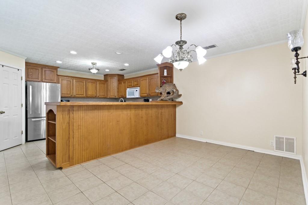 448 North Hill Road Tyler, TX 75706 - Photo 10 of 33 a view of a kitchen with a sink stainless steel appliances and cabinets