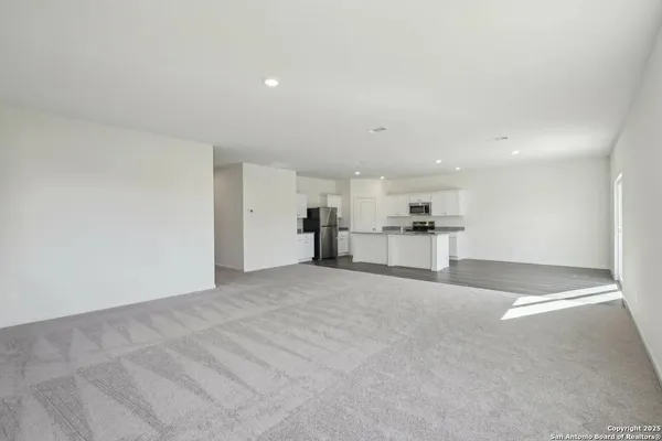 a view of a kitchen with a sink and cabinets