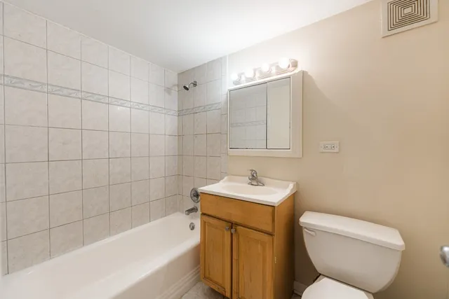 a bathroom with a toilet sink and bathtub