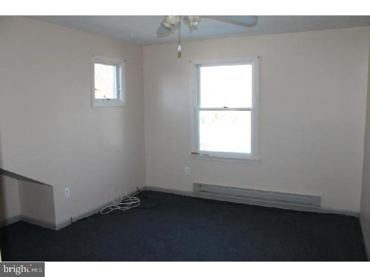 1698 Pennington Road, Unit 2 Trenton, NJ 08618 - Photo 4 of 7 a view of an empty room with a window