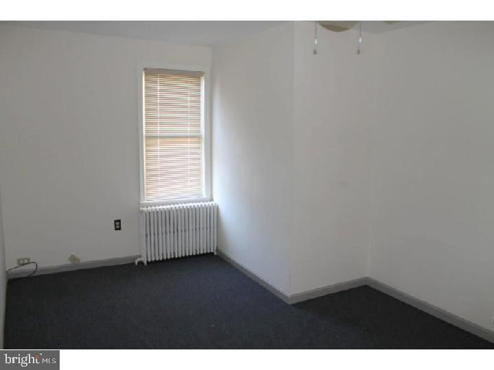 1698 Pennington Road, Unit 2 Trenton, NJ 08618 - Photo 5 of 7 a view of an empty room with a window