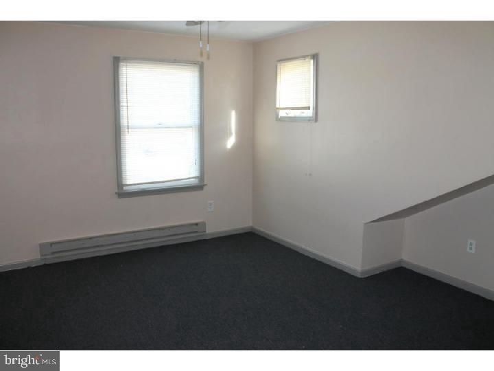 1698 Pennington Road, Unit 2 Trenton, NJ 08618 - Photo 6 of 7 a view of an empty room with a window