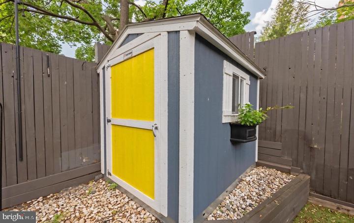 2317 37th Street Northwest Washington, DC 20007 - Photo 53 of 54 Charming garden shed with vibrant hues.