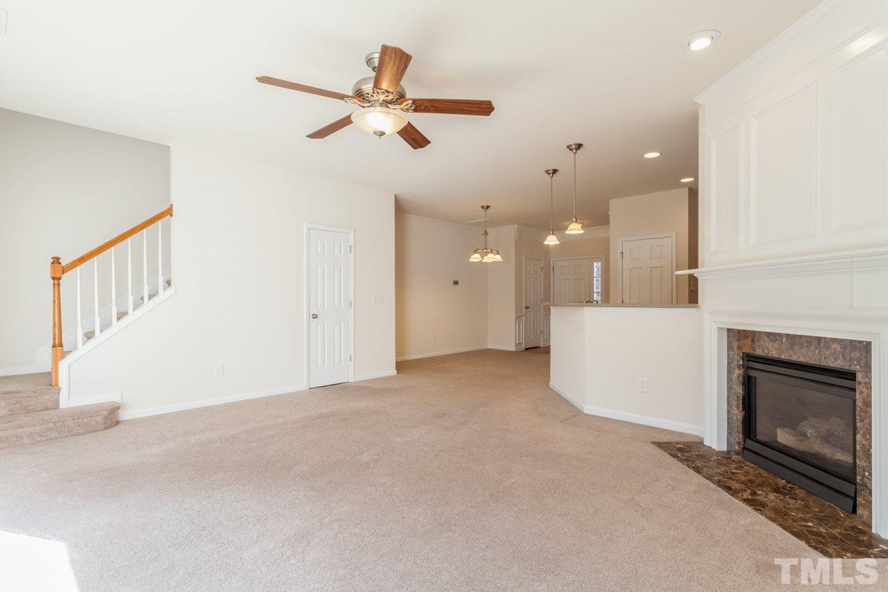 7006 Racine Way Raleigh, NC 27690 - Photo 21 of 24 a view of an empty room with a fireplace