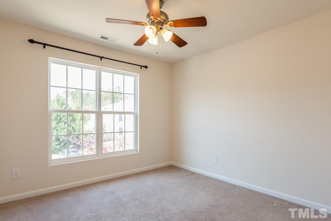 7006 Racine Way Raleigh, NC 27690 - Photo 24 of 24 an empty room with windows and fan