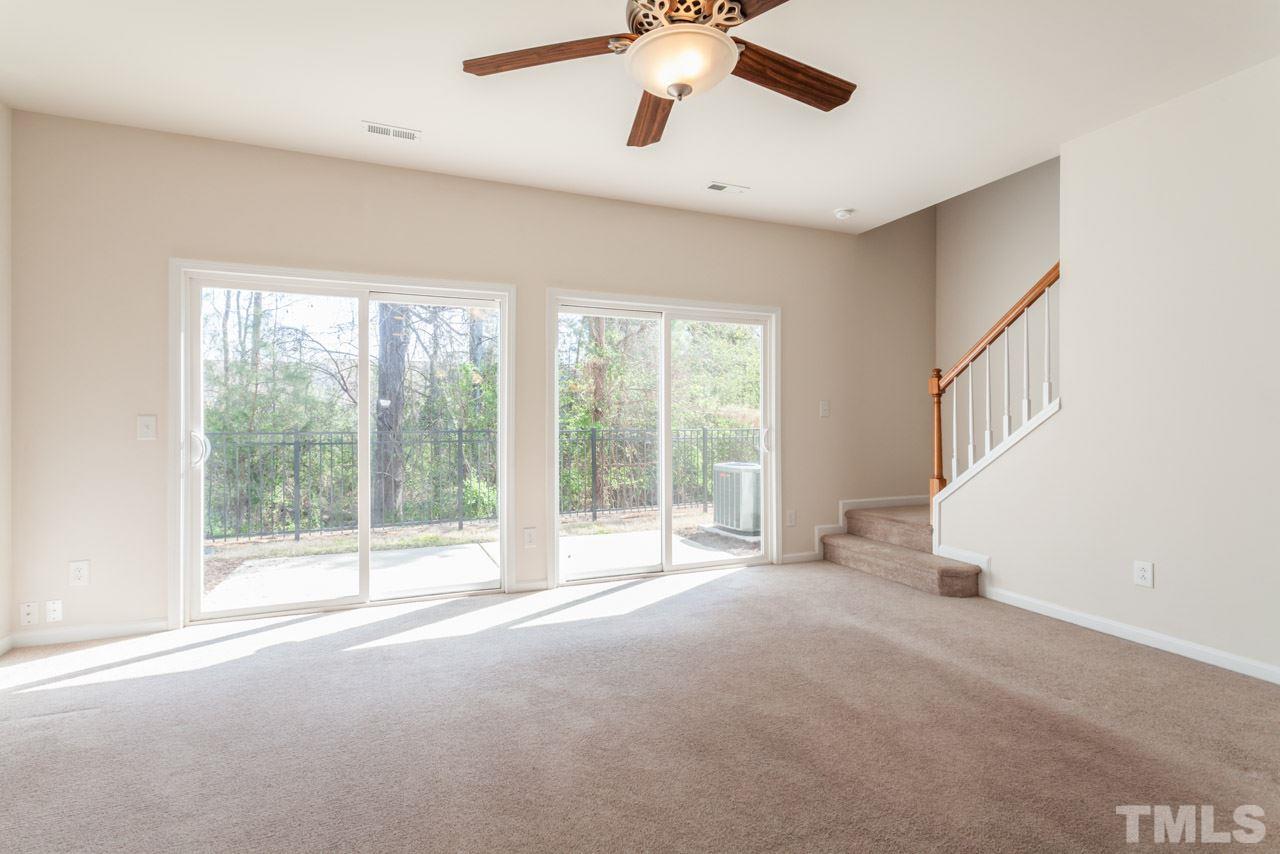 7006 Racine Way Raleigh, NC 27690 - Photo 7 of 24 a view of an empty room with a window