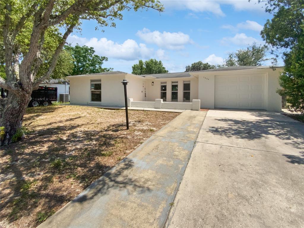 7604 Tyson Drive Port Richey, FL 34668 - Photo 1 of 1 a backyard of a house
