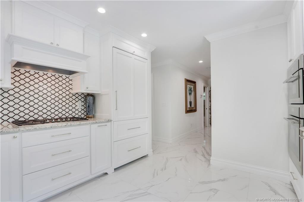 24 Emarita Way Sewall's Point, FL 34996 - Photo 12 of 26 a bathroom with a shower and a sink