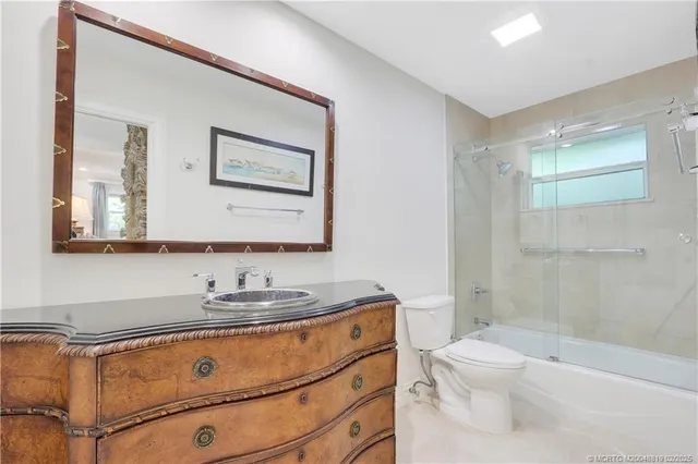 a bathroom with a shower and a toilet