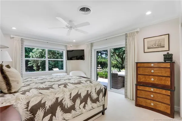 a bedroom with a bed and a table