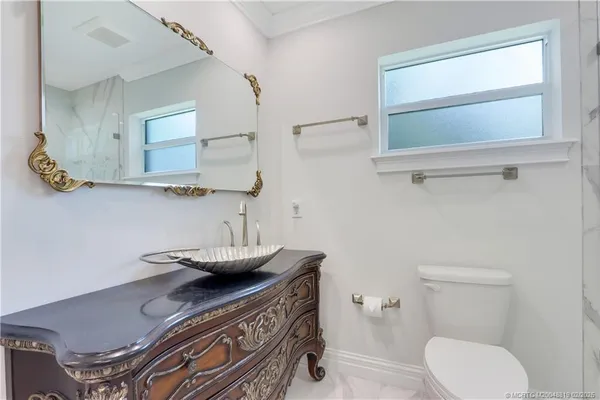 a bathroom with a shower and a toilet