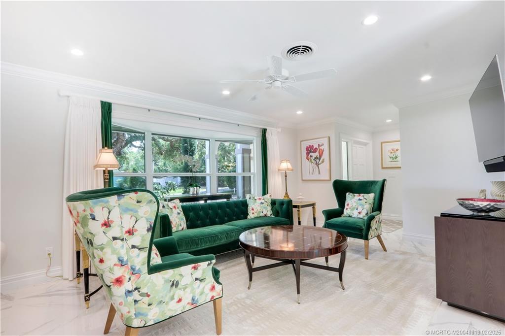 24 Emarita Way Sewall's Point, FL 34996 - Photo 6 of 26 a living room with furniture and a large window