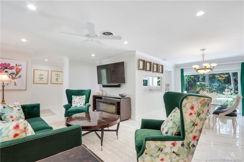 24 Emarita Way Sewall's Point, FL 34996 - Photo 7 of 26 a living room with furniture and a flat screen tv