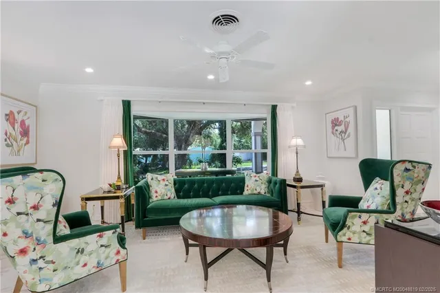 a view of a dining room with furniture wooden floor and chandelier