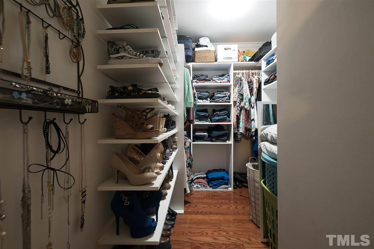 6008 East Pool Road Rougemont, NC 27572 - Photo 14 of 25 a view of walk in closet with clothes and shoes