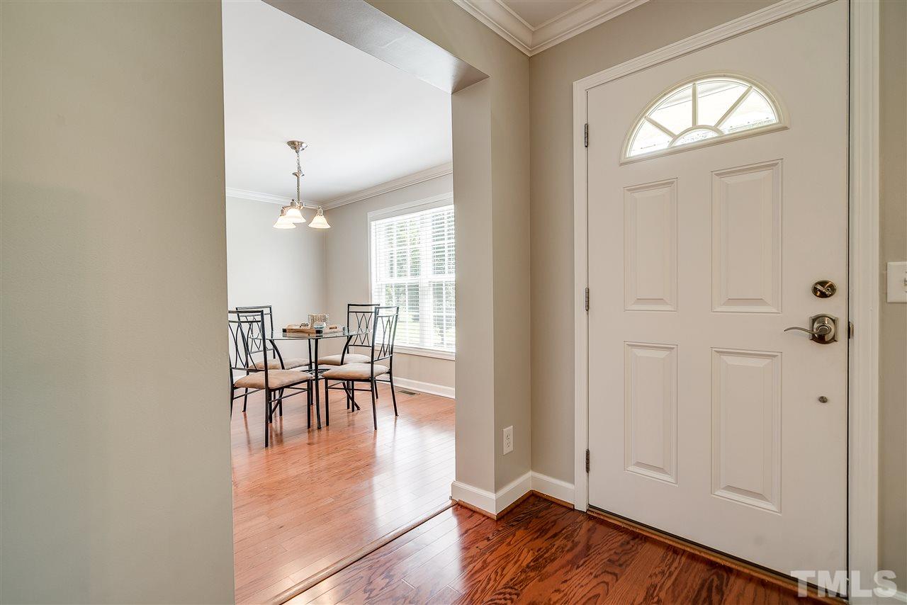 6008 East Pool Road Rougemont, NC 27572 - Photo 3 of 25 a view of a dining room with furniture and a chandelier