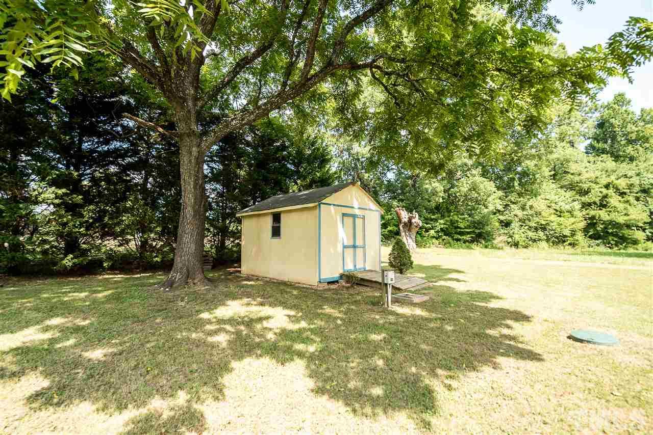 6008 East Pool Road Rougemont, NC 27572 - Photo 23 of 25 a view of a house with a yard