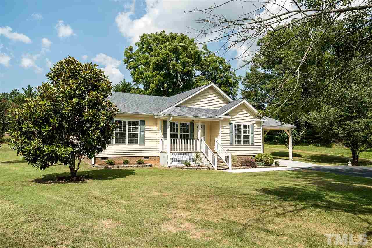 6008 East Pool Road Rougemont, NC 27572 - Photo 24 of 25 a front view of a house with a yard