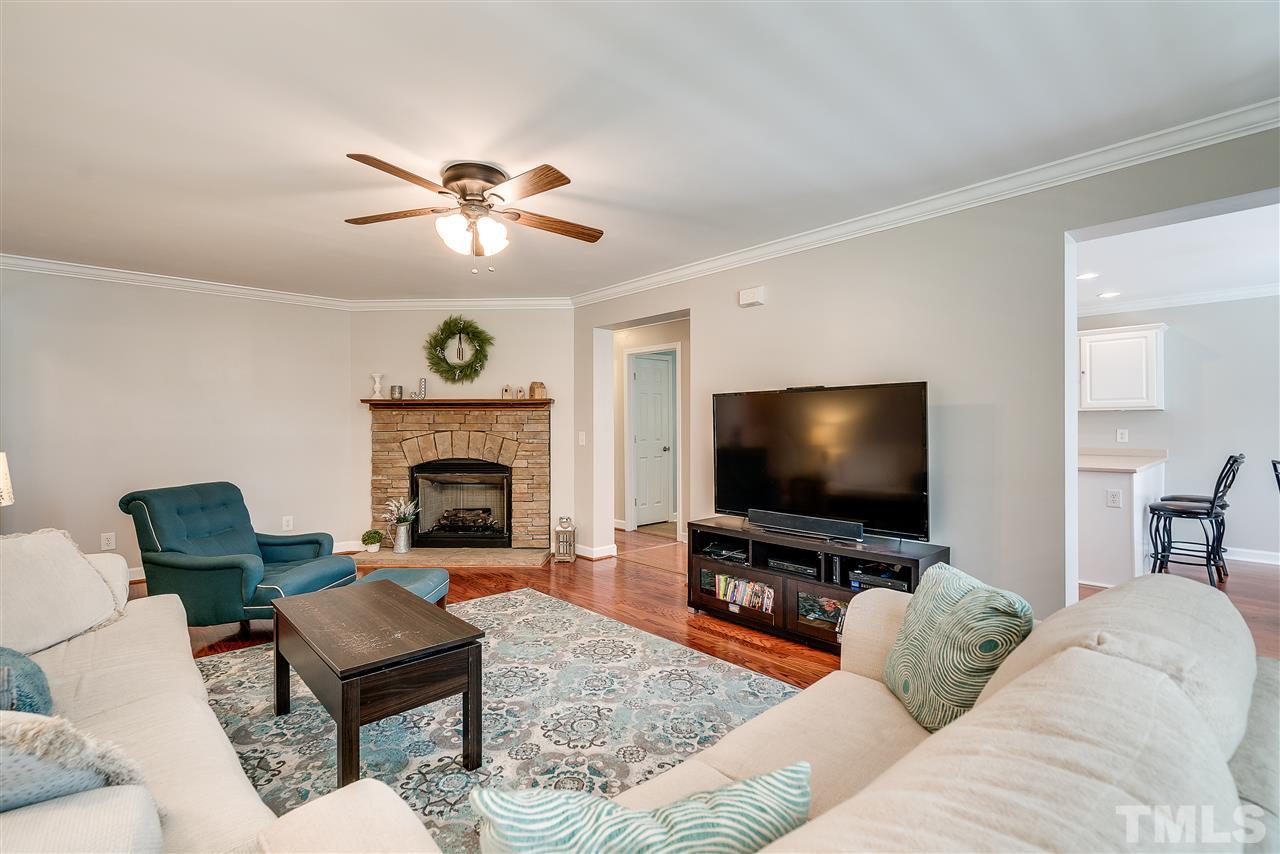 6008 East Pool Road Rougemont, NC 27572 - Photo 5 of 25 a living room with furniture and a fireplace