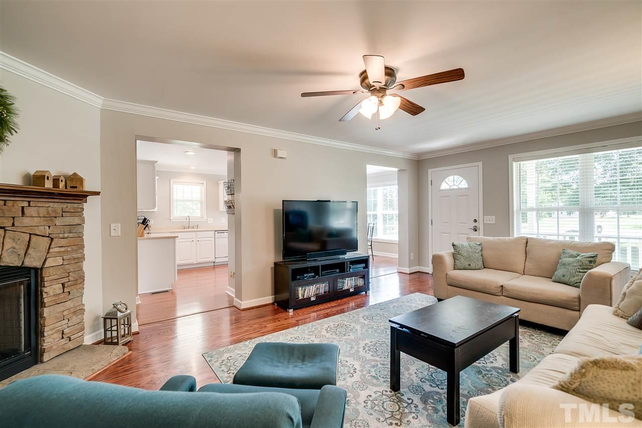 6008 East Pool Road Rougemont, NC 27572 - Photo 6 of 25 a living room with furniture and a flat screen tv