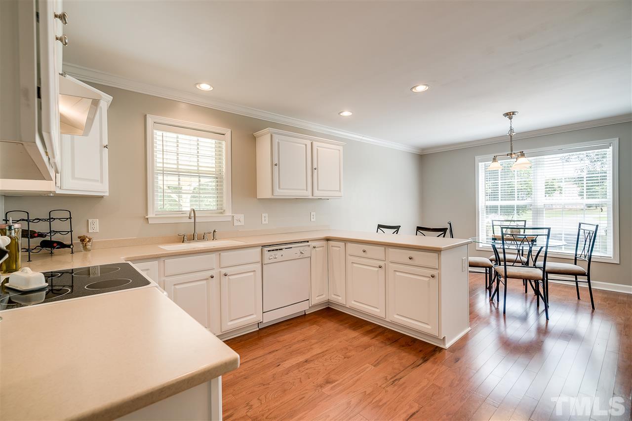 6008 East Pool Road Rougemont, NC 27572 - Photo 10 of 25 a kitchen with sink cabinets and dining table