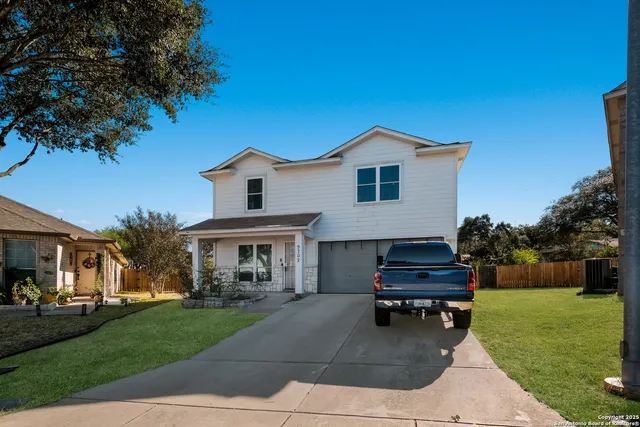 a spacious bedroom with a bed and a chandelier