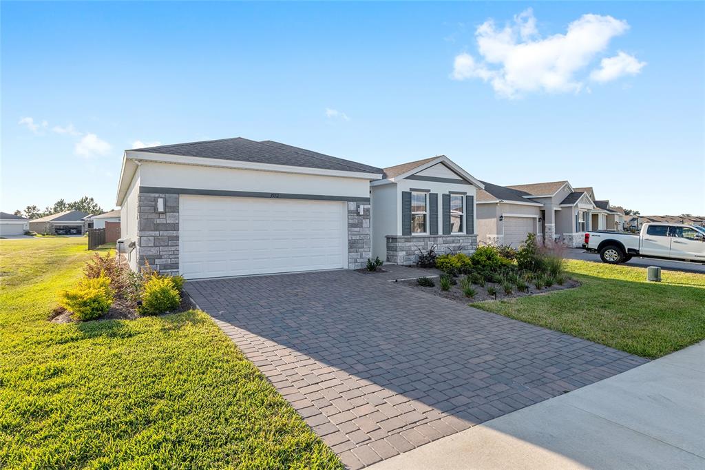 3972 Northwest 48th Terrace Ocala, FL 34482 - Photo 2 of 63 a front view of a house with a yard