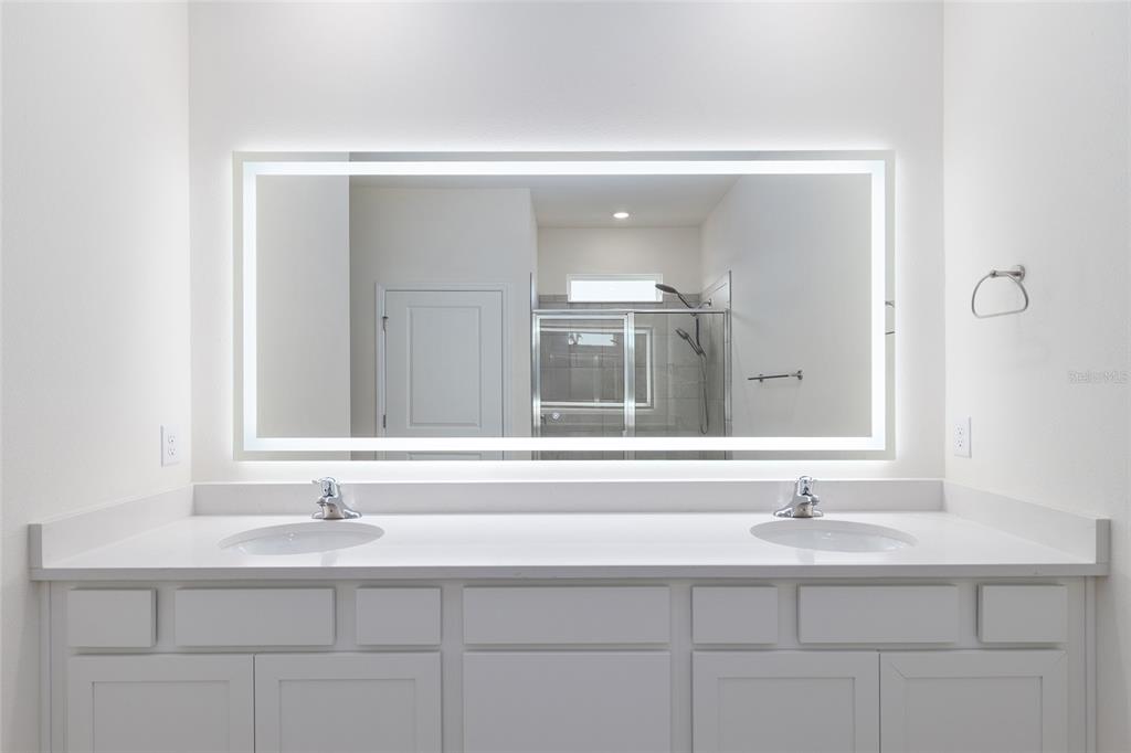 3972 Northwest 48th Terrace Ocala, FL 34482 - Photo 35 of 63 a bathroom with a sink and a mirror