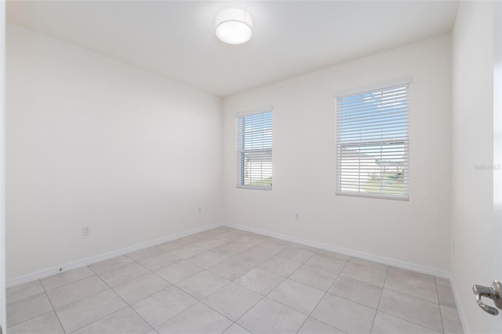 3972 Northwest 48th Terrace Ocala, FL 34482 - Photo 40 of 63 an empty room with windows
