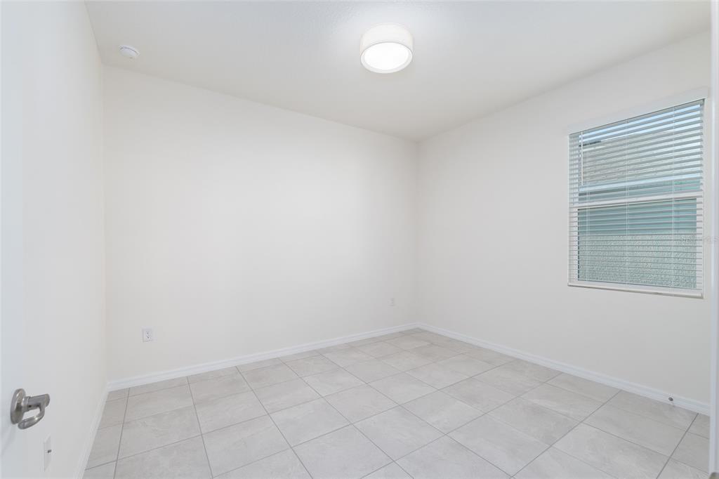 3972 Northwest 48th Terrace Ocala, FL 34482 - Photo 44 of 63 an empty room with a window
