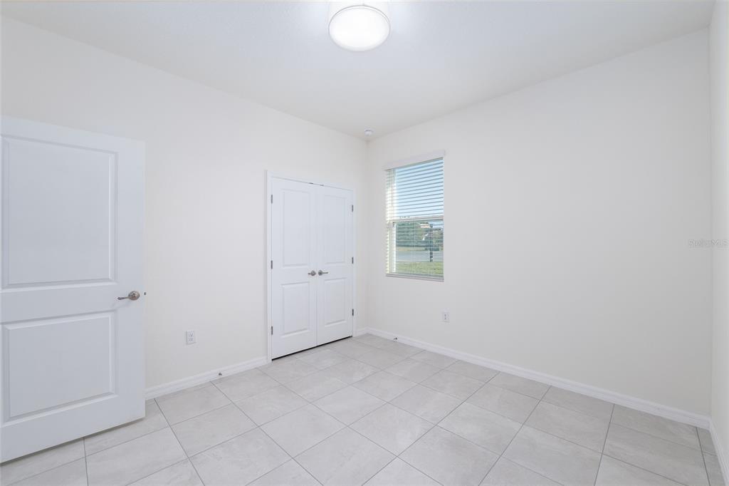 3972 Northwest 48th Terrace Ocala, FL 34482 - Photo 48 of 63 an empty room with a natural light