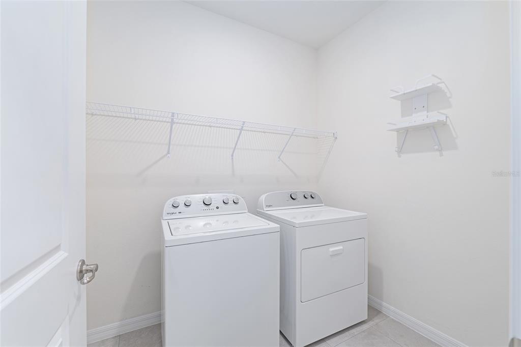 3972 Northwest 48th Terrace Ocala, FL 34482 - Photo 50 of 63 a utility room with dryer and washer