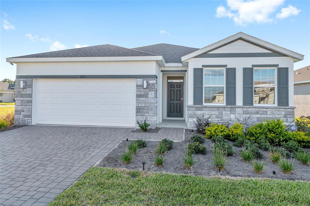 3972 Northwest 48th Terrace Ocala, FL 34482 - Photo 5 of 63 front view of a house with a yard